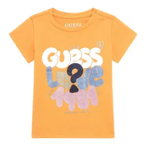 Оранжева тениска с къс ръкав с цветни надписи и глитери за момиче Guess